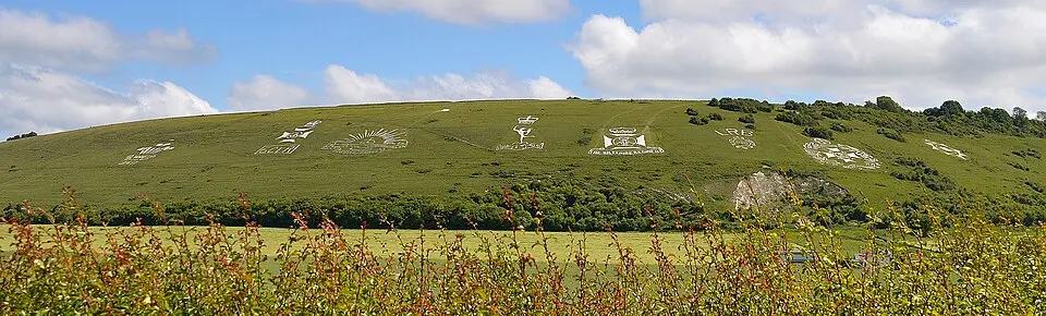 Two chalk military badges 380m and 550m west of Sheep Well