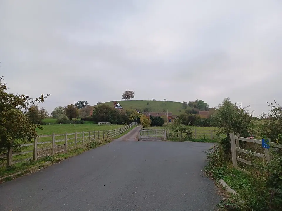 Motte castle, moated site, and medieval agricultural remains at Crookbarrow Farm